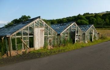 Derelict glasshouses at Underbank serve as a reminder of lost industry in the valleys