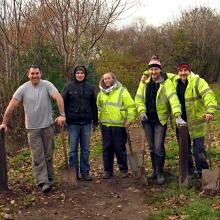 A group of volunteers work on a pathway at Morgan Glen